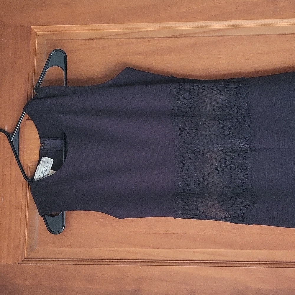 Blue sleeveless jumpsuit with lace see thru mid section.